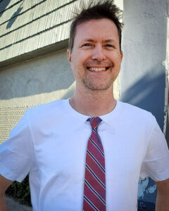 David Anderson, owner of Imprint Revolution, sporting one of their "tie t-shirts".
