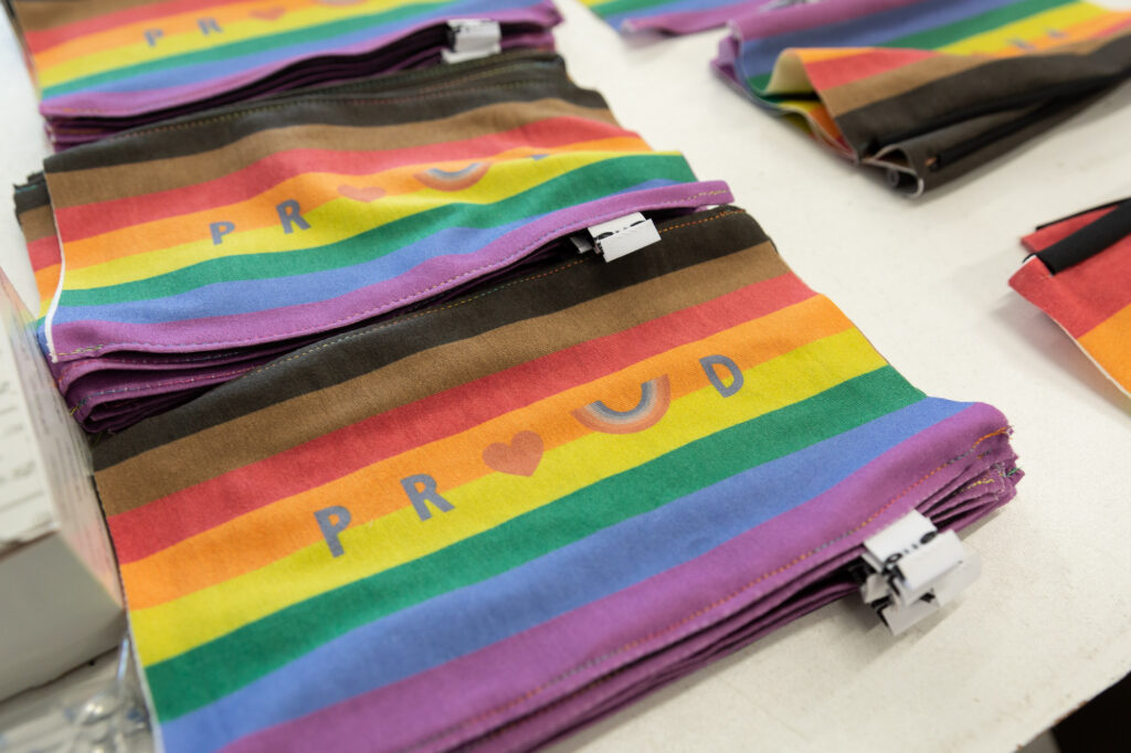 A pride flag is printed on fabric to be made into face masks.